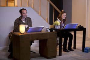 Separate but Together: Left to right; Danny Wolohan (Timothy) and Birgit Huppuch (Tara) sit at their desks, in the same room specially but in their own homes.